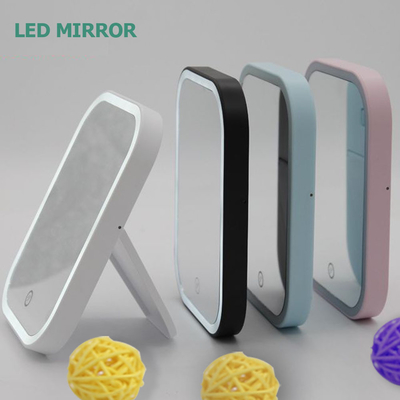 Espelho de maquiagem iluminado por LED ajustável para uma casa compacta e conveniente